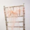 Location noeud de chaise organza pêche pastel
