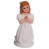 figurine communiante sur genoux